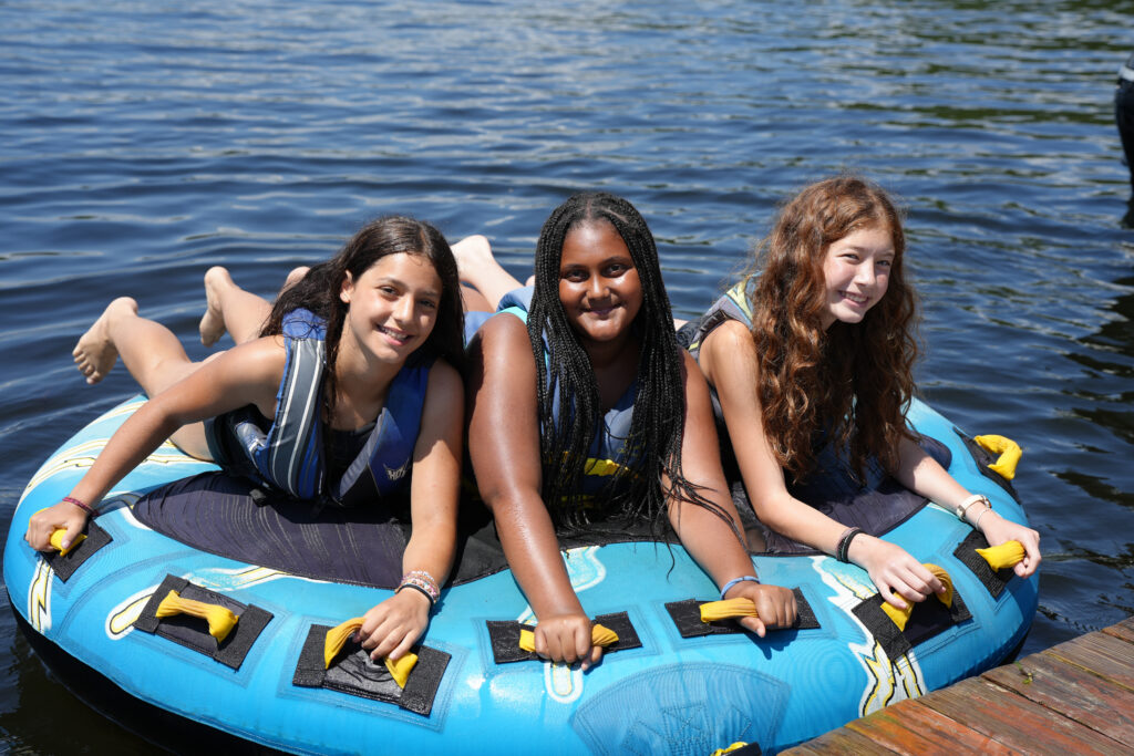 girls riding a tube