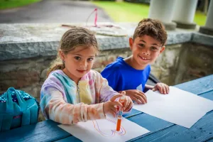 First-time campers experiencing Rookie Day trial program activities at Camp Lakota near Masten Lake