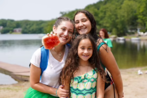 Campers exploring nature trails and outdoor adventures near Masten Lake at Camp Lakota in Wurtsboro