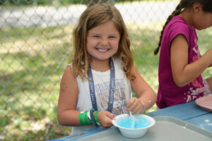 camper at Camp Lakota doing an art project