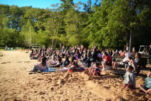Camp Lakota campers on the beach of Lake Masten